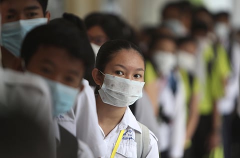 Students line up to sanitize their hands to avoid the contact of coronavirus before their morning class at a hight school in Phnom Penh, Cambodia, Tuesday, Jan. 28, 2020. (Photo | AP)