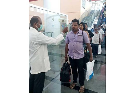 Health officials screening passengers at the Coimbatore International Airport. (Photo | EPS)