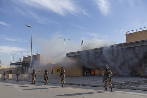 Iraqi army soldiers are deployed in front of the U.S. embassy, in Baghdad, Iraq. (Photo | AP)