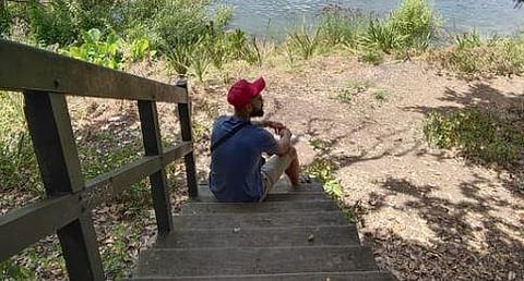 In an image shared by himself on Instagram, Kohli is seen sitting on the stairs near a lake in a picturesque location. (Photo | Twitter)