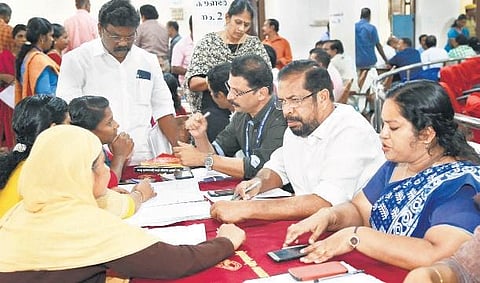 Mayor K Sreekumar and Deputy Mayor Rakhi Ravikumar hearing  the complainants at the adalat on Thursday. (photo| EPS)