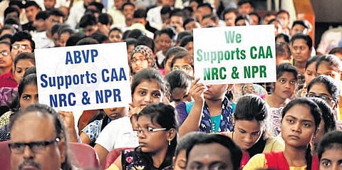 Students hold pro-CAA placards during BJP national general secretary Ram Madhav’s meeting, in Osmania University on Friday. This image is used for representational purposes. (Photo | S Senbagapandiyan, EPS)