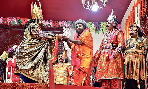 Lalit Mohan Panda (centre) along with King Kansa and other characters during an act at Rang Sabha in Bargarh| EXPRESS
