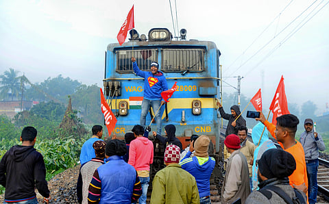 Members of AITUC and INTUC block a train during the trade unions' nationwide strike in West Midnapore district of West Bengal Wednesday Jan. 8 2020. (Photo | PTI)