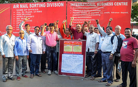 Members of a trade union stage a protest during the 24-hour nationwide strike called by ten trade unions against the central government over various issues in Mumbai (Photo| PTI)