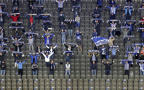 Supporters sing the team's anthem prior to the German Bundesliga soccer match between Hertha BSC Berlin and Eintracht Frankfurt in Berlin, Germany, Friday, Sept. 25, 2020. (Photo | AP0