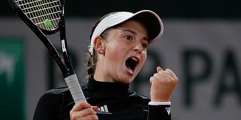 Jelena Ostapenko celebrates after winning her second round match of the French Open tournament against Karolina Pliskova in straight sets at the Roland Garros stadium in Paris. (Photo | AP)