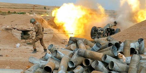 An Armenian soldier fires an artillery piece during fighting with Azerbaijan's forces in self-proclaimed Republic of Nagorno-Karabakh. (Photo | AP)