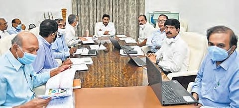 Chief Minister YS Jagan Mohan Reddy holds a review meeting on supply of 9-hour free power to the farm sector at his camp office in Tadepalli on Monday. (Photo | EPS)