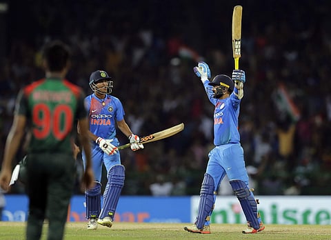 India's Dinesh Karthik, right, celebrates scoring the winning run to defeat Bangladesh by four wickets during the finals of Nidahas triangular Twenty20 cricket series in Colombo. (Photo | AP)