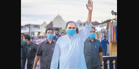 Odisha CM Naveen Patnaik waves to people during his visit to Puri on Saturday. (Photo | EPS)