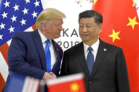 U.S. President Donald Trump, left, shakes hands with Chinese President Xi Jinping during a meeting. (File Photo | AP)