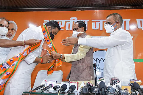 Congress MLA from Damoh, Rahul Lodhi joins BJP in the presence of Madhya Pradesh CM Shivraj Singh Chouhan and State BJP president V.D. Sharma at party office in Bhopal. (PTI)