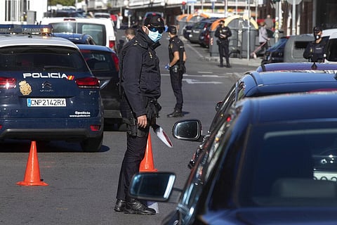Police mount a checkpoint on the outskirts of Madrid, Spain, Saturday, Oct. 3, 2020. (Photo | AP)