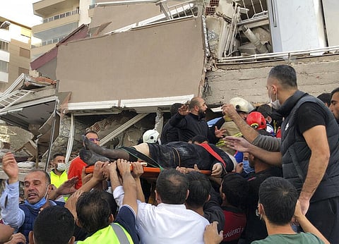A powerful earthquake hit Turkey and Greece on Friday, killing at least 26 people, levelling buildings and creating a sea surge that flooded streets near the Turkish resort city of Izmir. (Photo | AP)