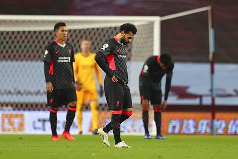 Liverpool's Mohamed Salah, gestures after Aston Villa's Ross Barkley scores his side's fifth goal. (Photo | AP)