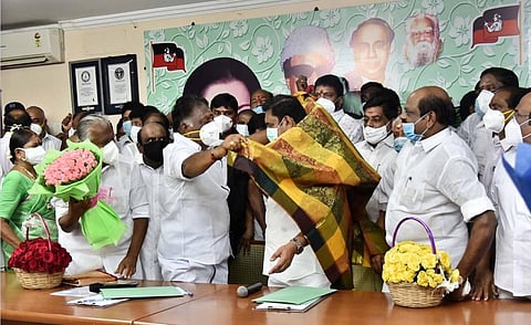 AIADMK party Co-ordinator O Panneervam presents a shawl to Joint Co-Ordinator Edapadi K Palaniswamy at the party headquarters in Chennai on Wednesday. (Photo | P Jawahar, EPS)
