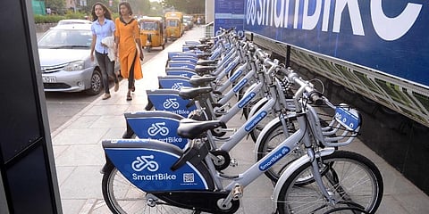 Smart bikes kept on the footpath outside Thirumangalam Metro station in Chennai. (Photo | Debadatta Mallick, EPS)
