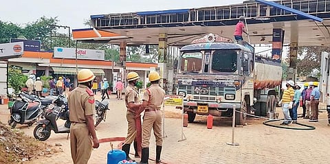 Technicians busy decanting diesel at Raj Bhawan petrol pump in Bhubaneswar on Thursday. (Photo| EPS)
