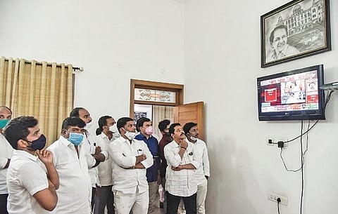 TRS workers anxiously watch the Dubbaka bypoll results on TV at TRS Bhavan in Hyderabad on Tuesday |  VINAY MADAPU