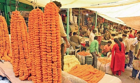 Customers throng a flower market  on the eve of Diwali in Hyderabad  on Friday | RVK Rao