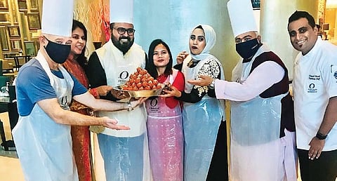Boondi laddoo-mixing with Oakwood general manager Wajeed Bagwan