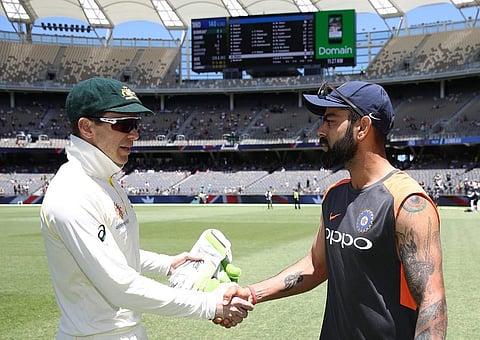 Tim Paine and Virat Kohli shake hands. (Photo | Twitter/cricket.com.au)