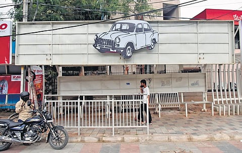 A cutout of TRS’ election symbol ‘car’ pasted atop a bus stop in Hyderabad, ahead of the GHMC polls  | Vinay Madapu