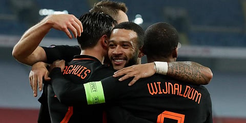 Netherlands' Steven Berghuis (L) and Memphis Depay celebrate with Georginio Wijnaldum who scored his side's second goal against Poland during the Nations League match in Chorzow. (Photo | AP)