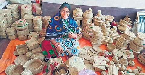 A woman with golden grass products at a village in Kendrapara district. (Photo| EPS)
