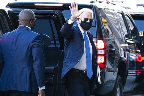 US President-elect Joe Biden waves as he arrives The Queen theater for a meeting with Vice President-elect Kamala Harris. (Photo | AP)