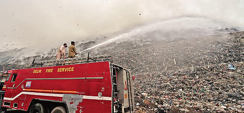 Fire fighters try to douse a fire that broke out at Ghazipur landfill site, the largest dumping site in New Delhi, on Wednesday | PARVEEN NEGI