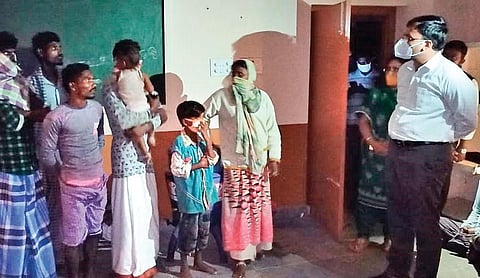 Collector KVN Chakradhar Babu interacts with evacuated people at a cyclone shelter  at Kothapatnam village in Kota mandal of Nellore district on Wednesday | Express