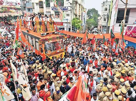 Union Home Minister Amit Shah holds a roadshow in Hyderabad’s Warasiguda on Sunday as part of BJP’s campaigning for the December 1 Greater Hyderabad Municipal Corporation election | S SENBAGAPANDIYAN