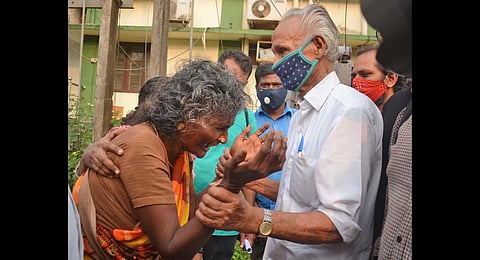 Kannammal, mother of Maoist Velmurugan who was shot down by the police, in tears in front of former Naxal Grow Vasu at Kozhikode Medical College. (Photo | Manu R Mavelil, EPS)
