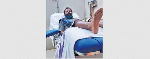 Anadaprasad donating blood at a hospital