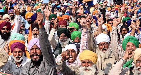 Farmers raise slogans at the Singhu border during 'Delhi Chalo' protest against the new farm laws, in New  Delhi. (Photo | Parveen Negi, EPS)
