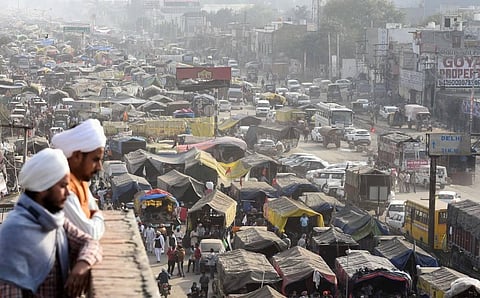 Farmers at the Singhu border during their Delhi Chalo protest against the new farm laws in New Delhi on Thursday. (Photo | Parveen Negi/EPS)