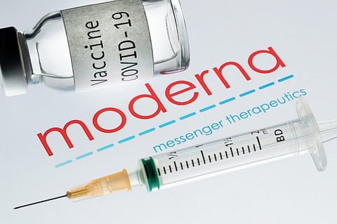 In this file photo taken on November 18, 2020 shows a syringe and a bottle reading 'Vaccine Covid-19' next to the Moderna biotech company logo. (Photo | AFP)
