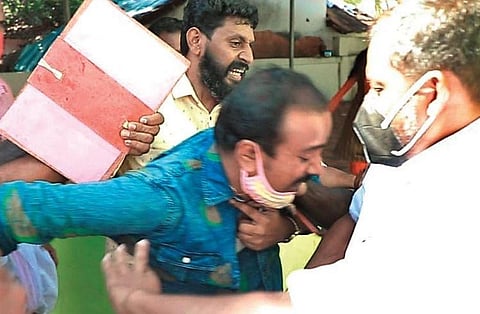 Printu N A being manhandled at a booth in Kizhakkambalam on Thursday | Express