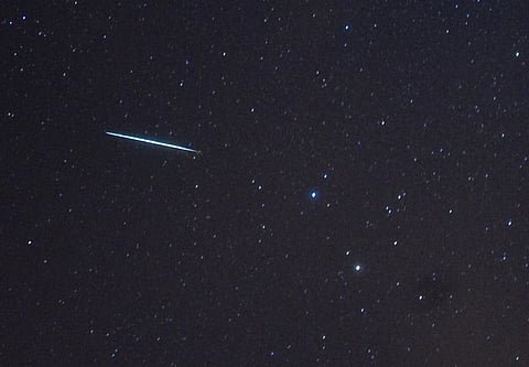Image used for representational purposes only. A meteor (L) from the Geminids meteor shower enters the Earth's atmosphere. 