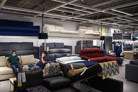 Customers sit on sofas on display at the new IKEA store in Navi Mumbai . (Photo| AFP)