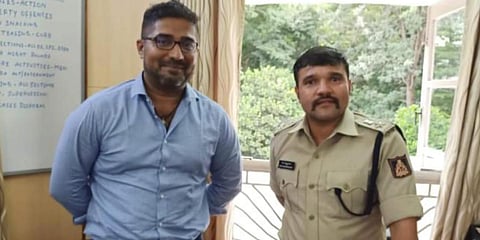 Karthik Narayan with IPS officer Ravi Chennanavar (Photo| Special Arrangement)
