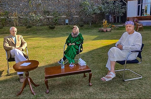 Mehbooba Mufti interacts with J K National Conference President Farooq Abdullah and leader Omar Abdullah at her residence in Srinagar Wednesday Oct. 14 2020. (Photo | PTI)