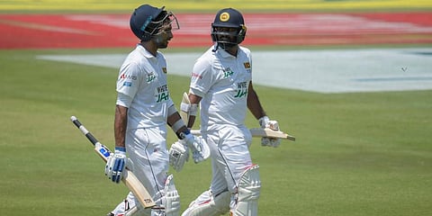 Sri Lanka's Dasun Shanaka (L) and Lahiru Kumara walk on the field after South Africa bowled them out for 376 runs, on day two of the first Test at Super Sport Park Stadium in Pretoria. (Photo | AP)