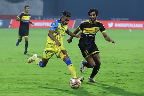 BFC's Rahul KP dribbles past HFC's Akash Mishra during match 40 of Hero ISL7 at the Bambolim Stadium on Sunday. (Photo| ISL Media)
