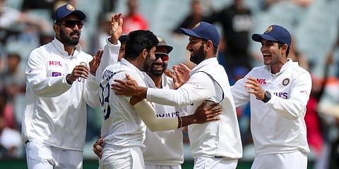 India's Jasprit Bumrah, second left, is congratulated by teammates after dismissing Australia's Steve Smith during play on day three of the second Test at the MCG. (Photo | AP)