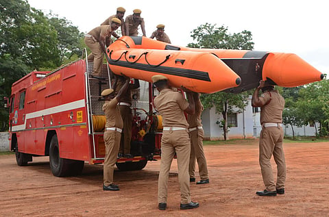 Firemen of Tirunelveli Palayamkottai take a rescue boat for deployment (Photo | EPS/ V. Karthikalagu)