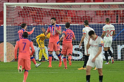 Chelsea's French striker Olivier Giroud (C) celebrates with teammates after scoring his fourth goal during the UEFA Champions League group E football match. (Photo | AFP)