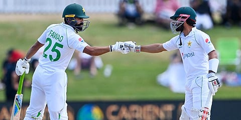 Pakistan's Fawad Alam (L) and his captain Mohammad Rizwan celebrate their 150 partnership during play on the final day of the first Test against New Zealand at Bay Oval. (Photo | AP)